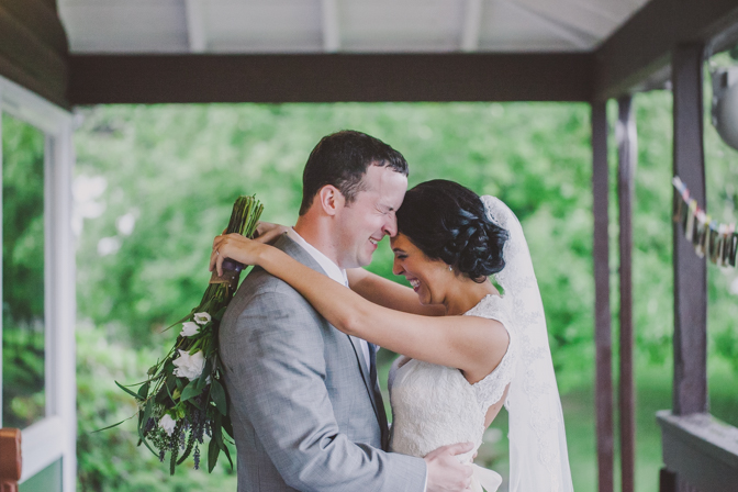 beautiful moment captured of bride and groom embracing