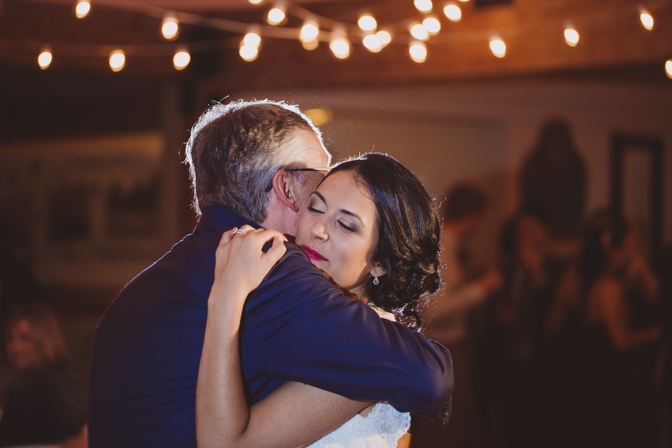 father daughter dance inside of farm lakehouse wedding