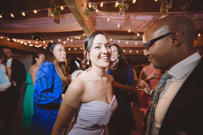 dancing shot of sister of the bride at Connecticut lake house wedding