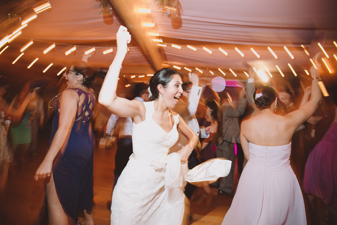 fun long exposure photo of bride dancing at her wedding
