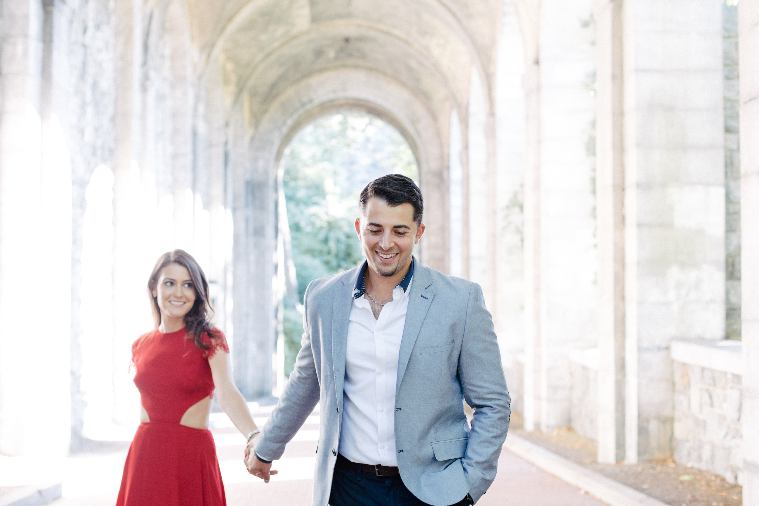 boy pulling girl towards him engagement session