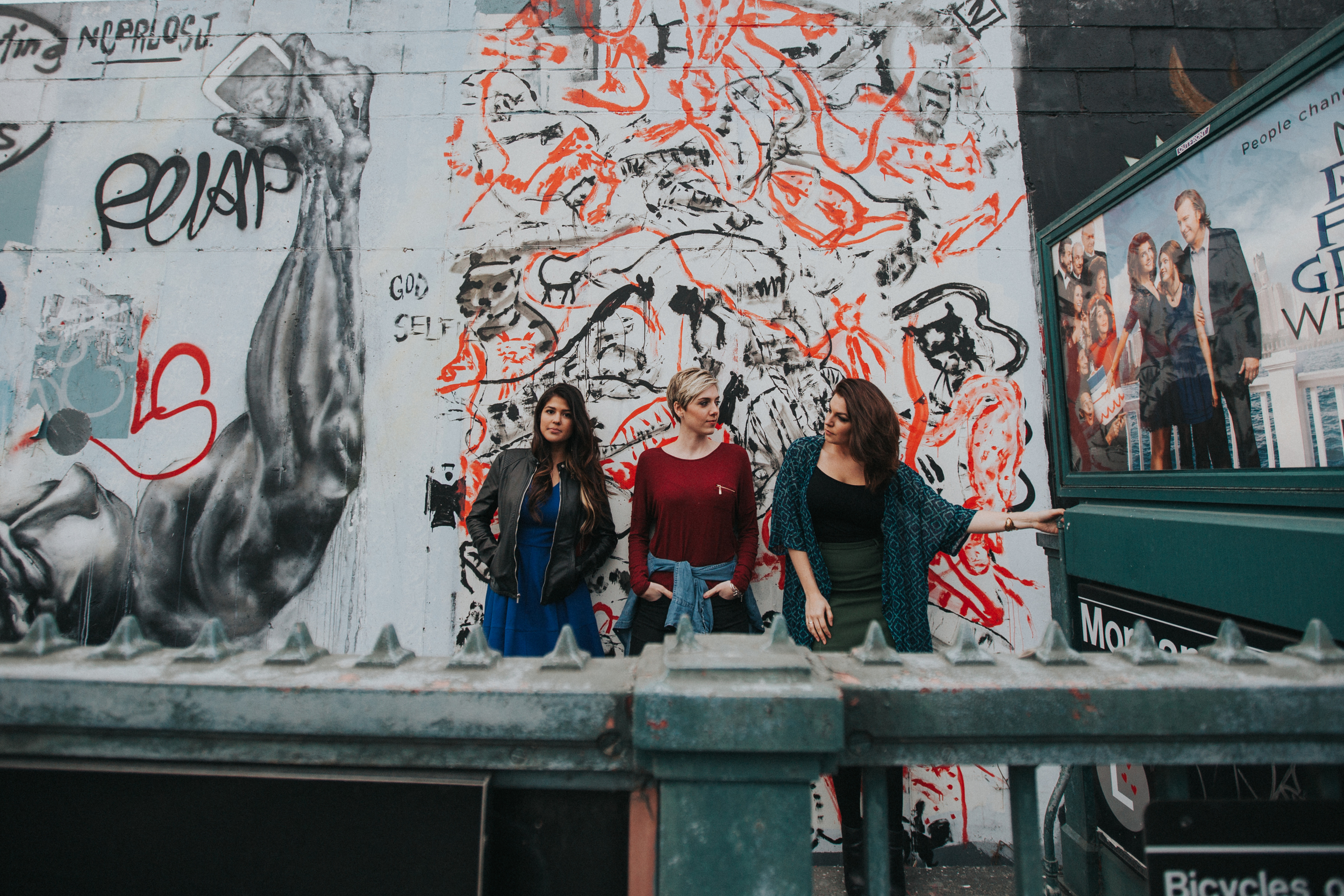 nyc models in front of graffiti wall