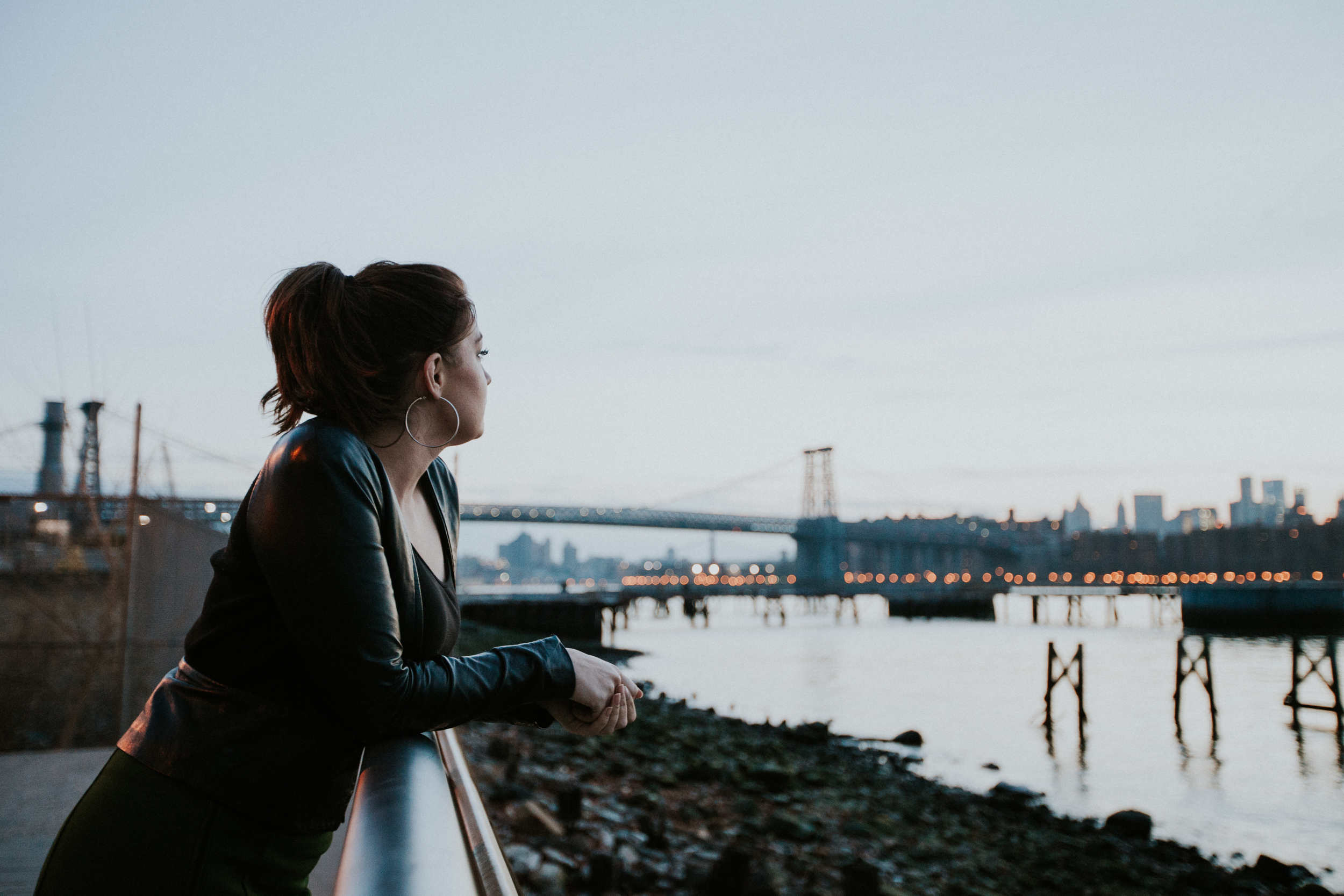 girl in front of nyc skyline sunset