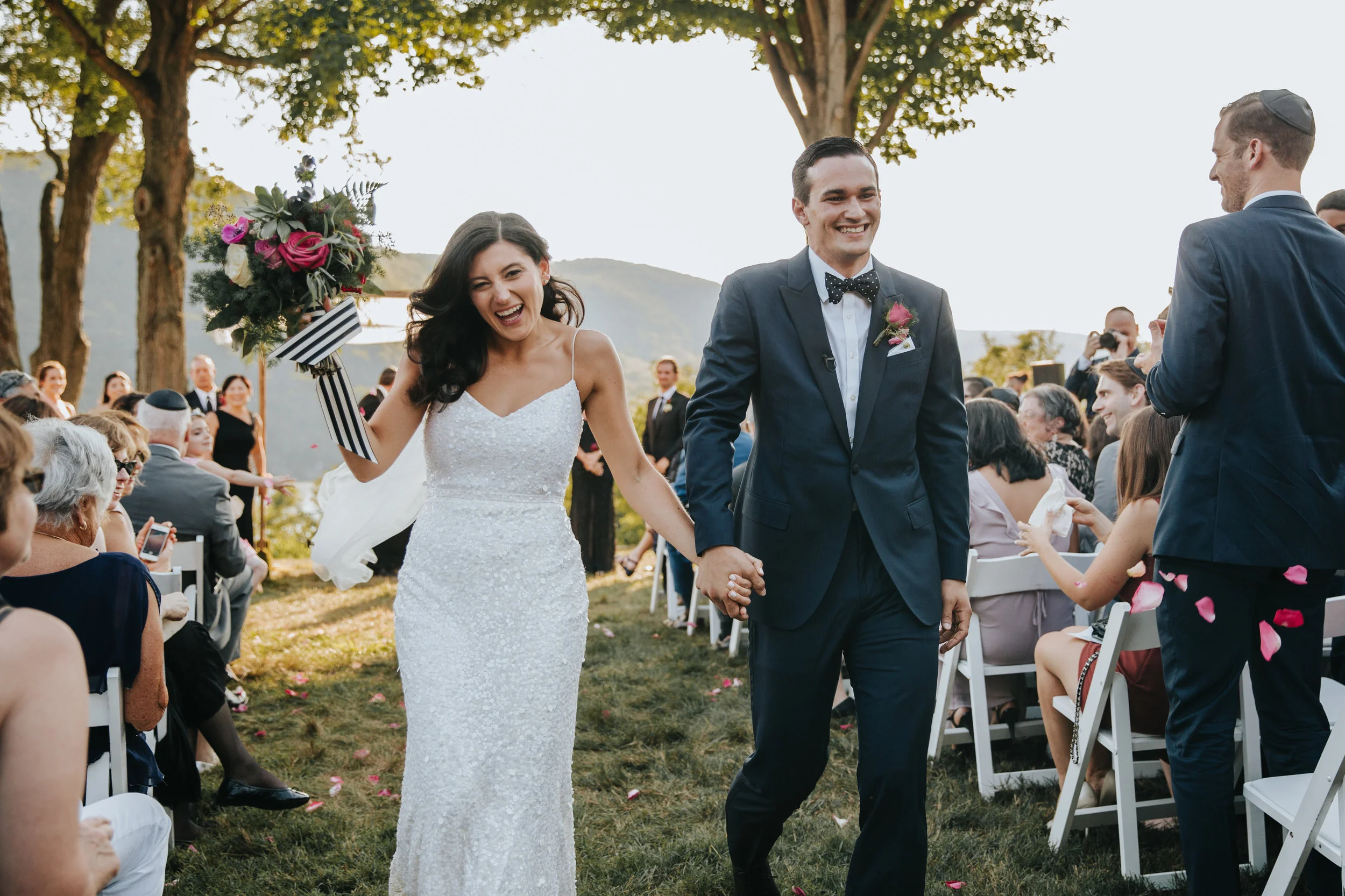 bride and groom walking down the isle