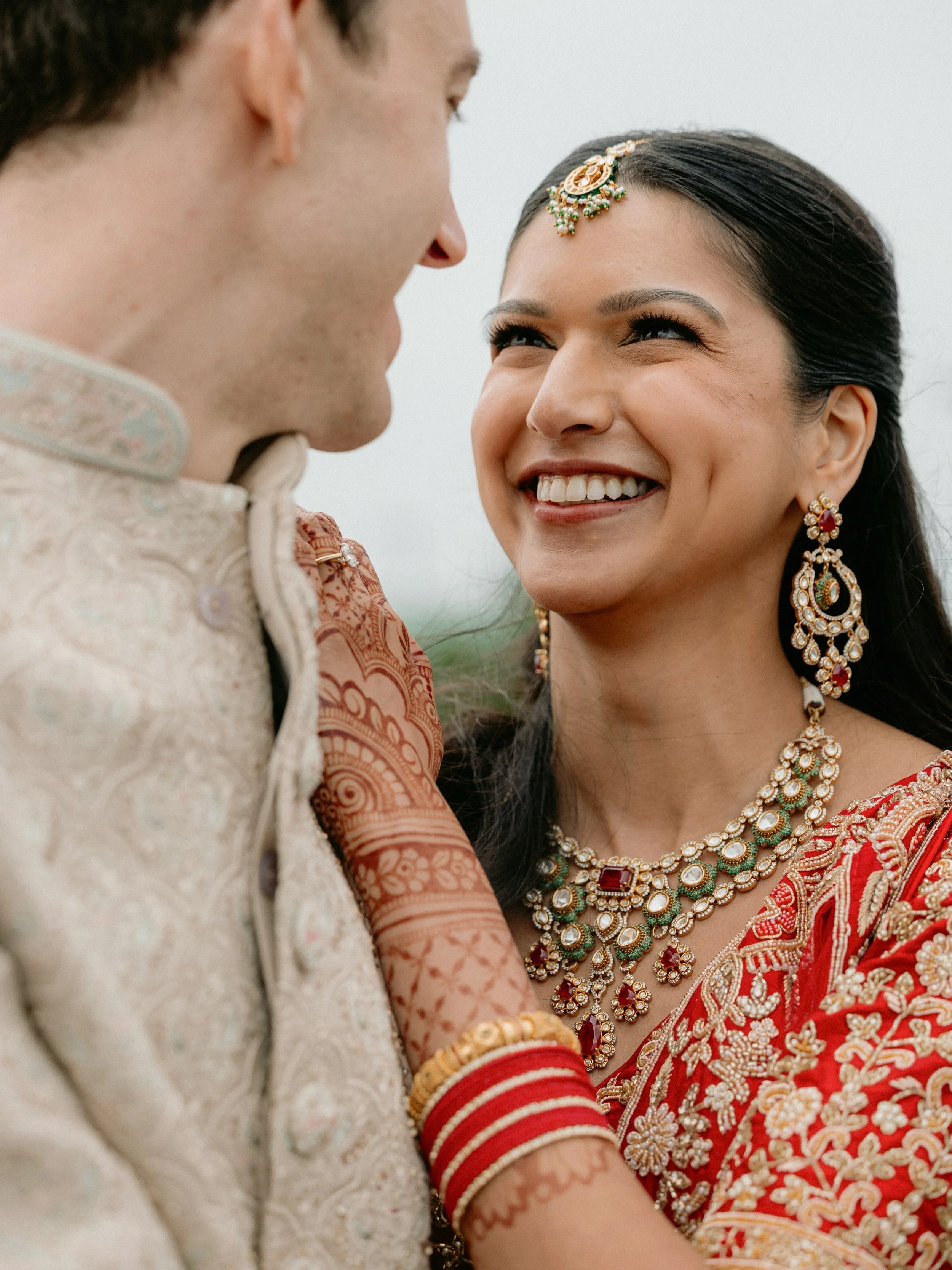 A wedding weekend with rain on the windows, color everywhere, two beautiful ceremonies, and the kind of joy that makes us feel part of the story.

Meg &amp; Travis brought together an incredible Indian celebration and Western ceremony, and every piec