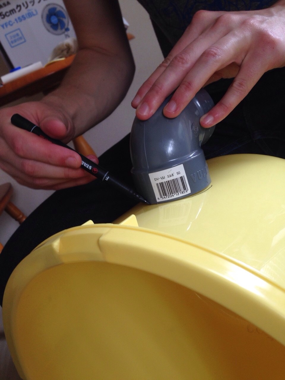  Next trace the shape of your PVC elbows on the sides of the bucket. 