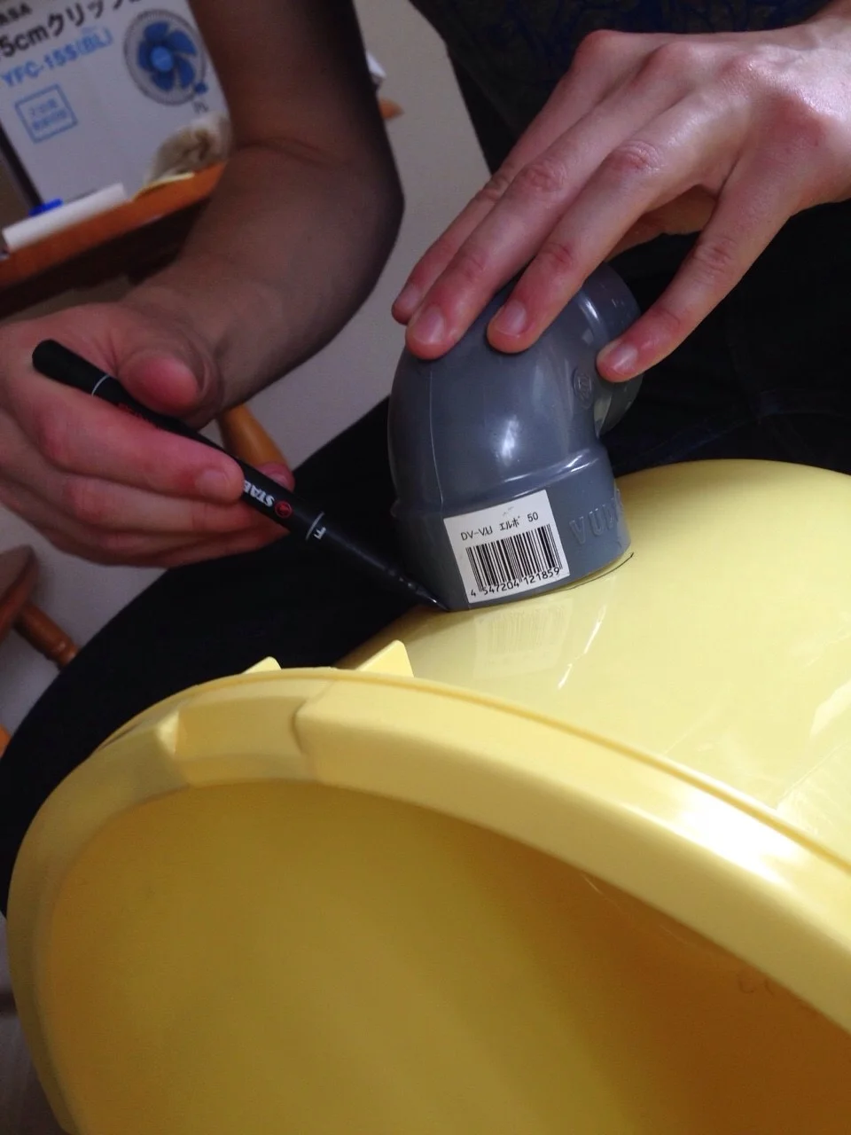 Next trace the shape of your PVC elbows on the sides of the bucket.