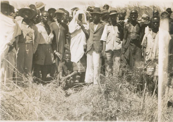 The Chief Designate - centre in white - prepares to swim to Kumbula Island. Photos by Mrs Anthea Bush the wife of Ronald Bush the District Commissioner.