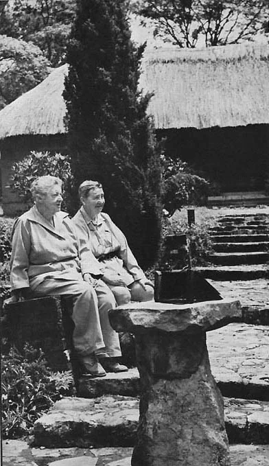 Marion and Hope Gamwell in the Italianate garden of Chilongowelo their farm on the Mpulungu Road. This was a charming group of stone built, thatched cottages linked by covered walk ways. Photo from Horizon