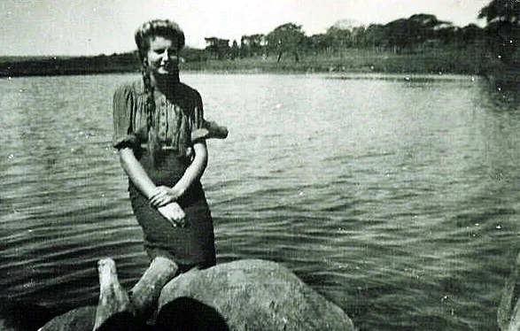 A Polish girl enjoys the delights of Lake Chila from the rocks at the source of the Lucheche stream. Courtesy Kresy-Siberia foundation. See thier website in the link section.