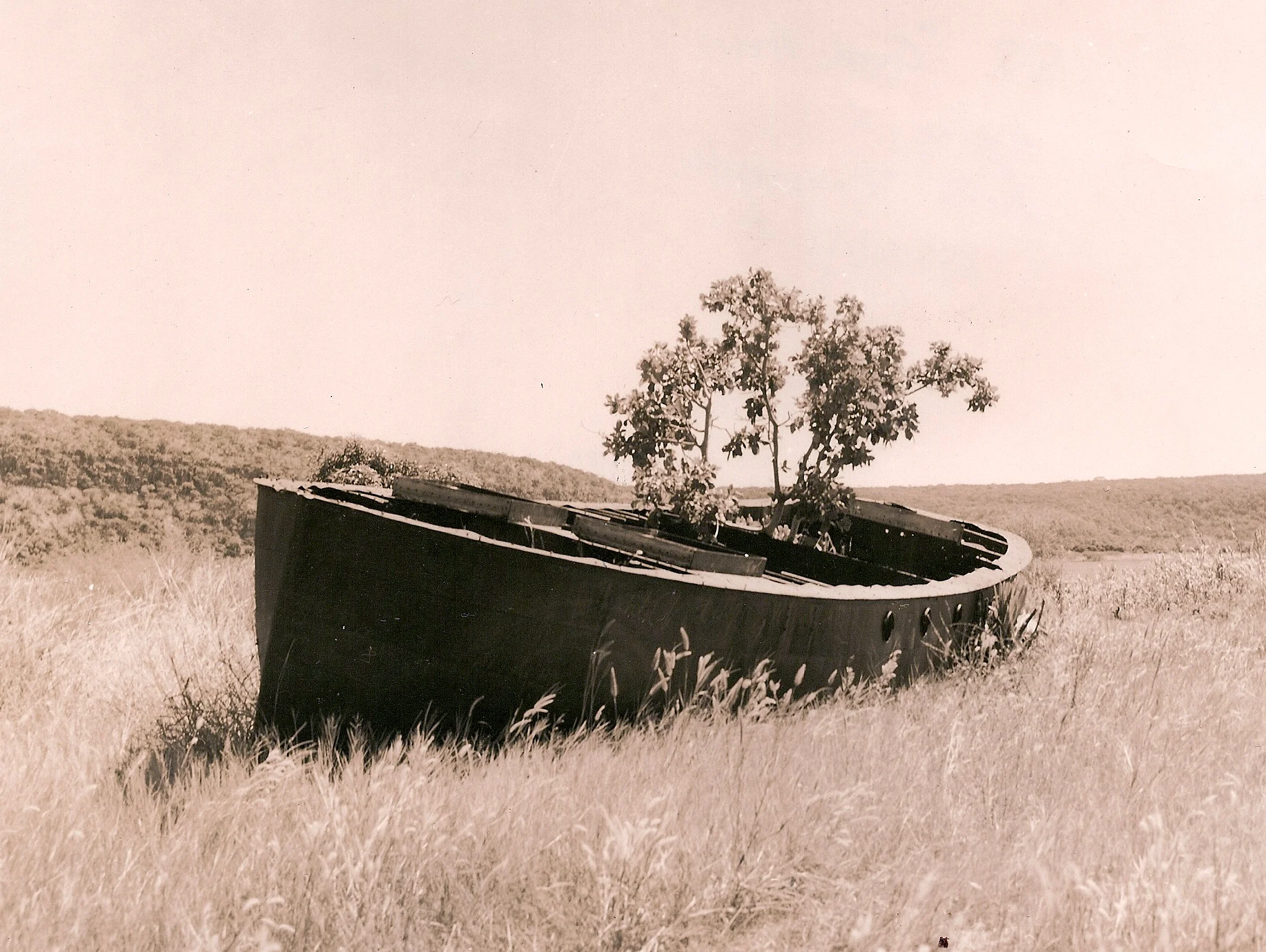 The SS Good News lying on the South West coast of Kituta Bay where the German naval forces had shelled her in 1915. Photo taken in the 1950s.