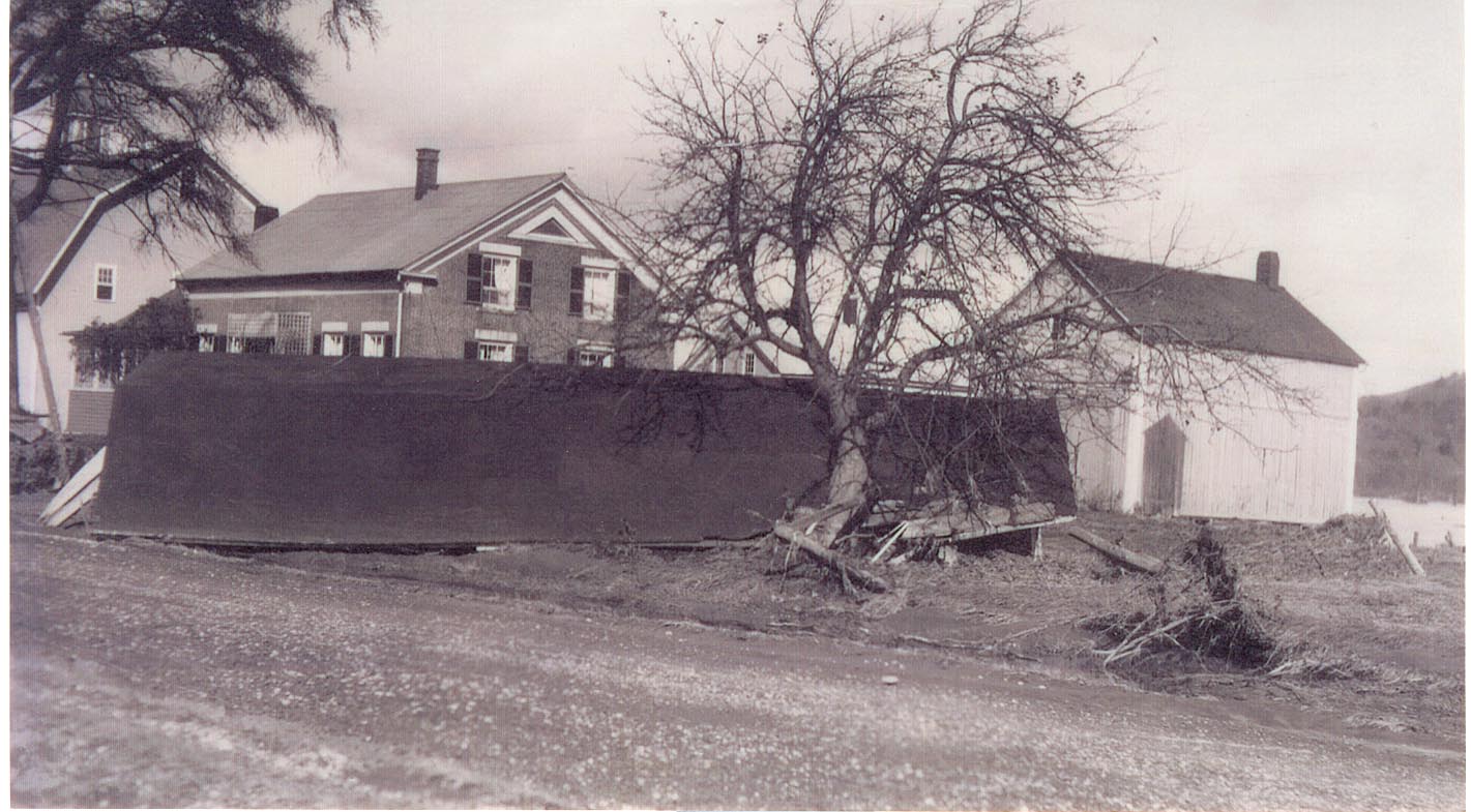 More damage from the flood of 1927. The farmhouse is narrowly spared!