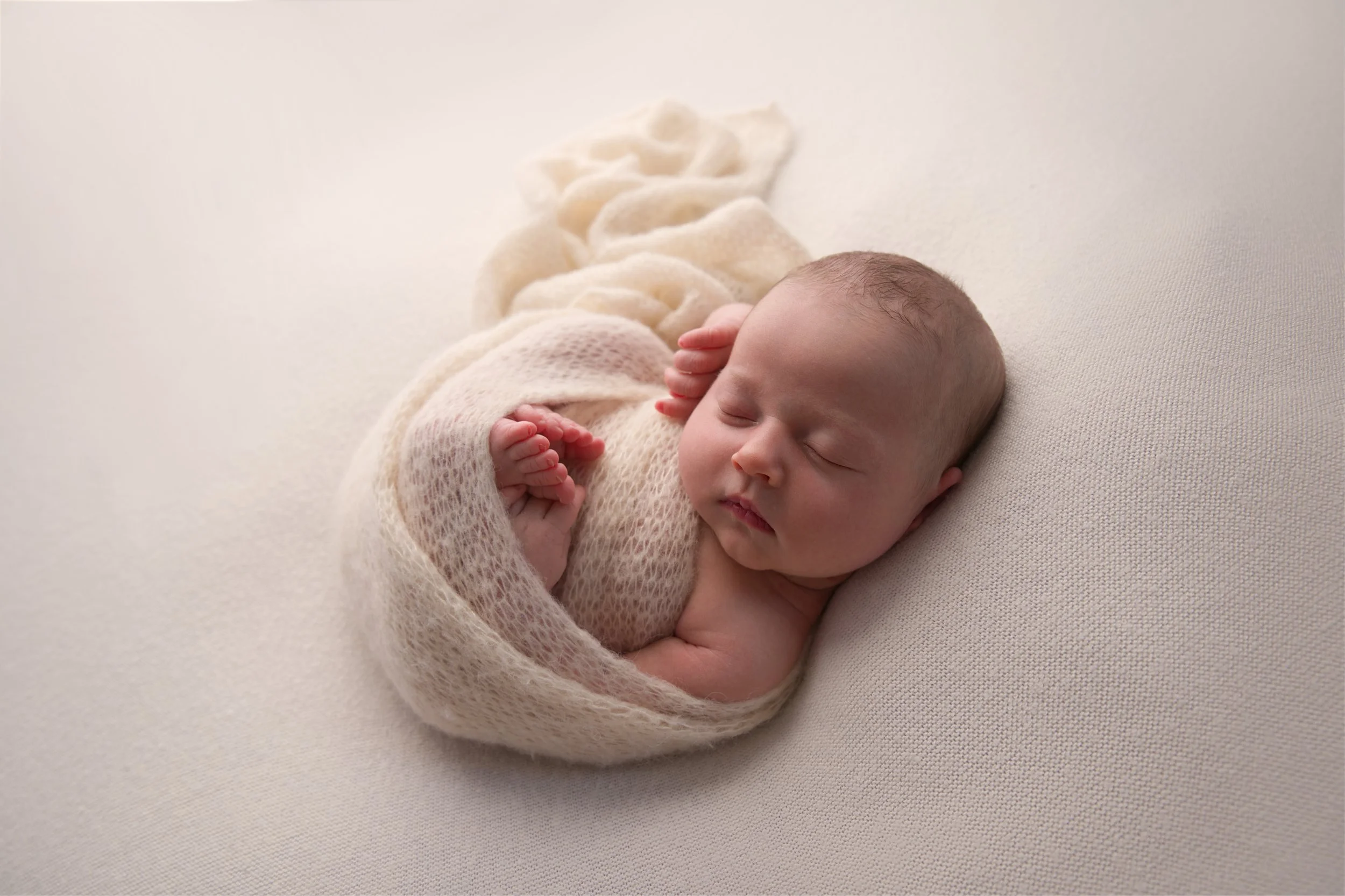 Baby boy in cream wrap