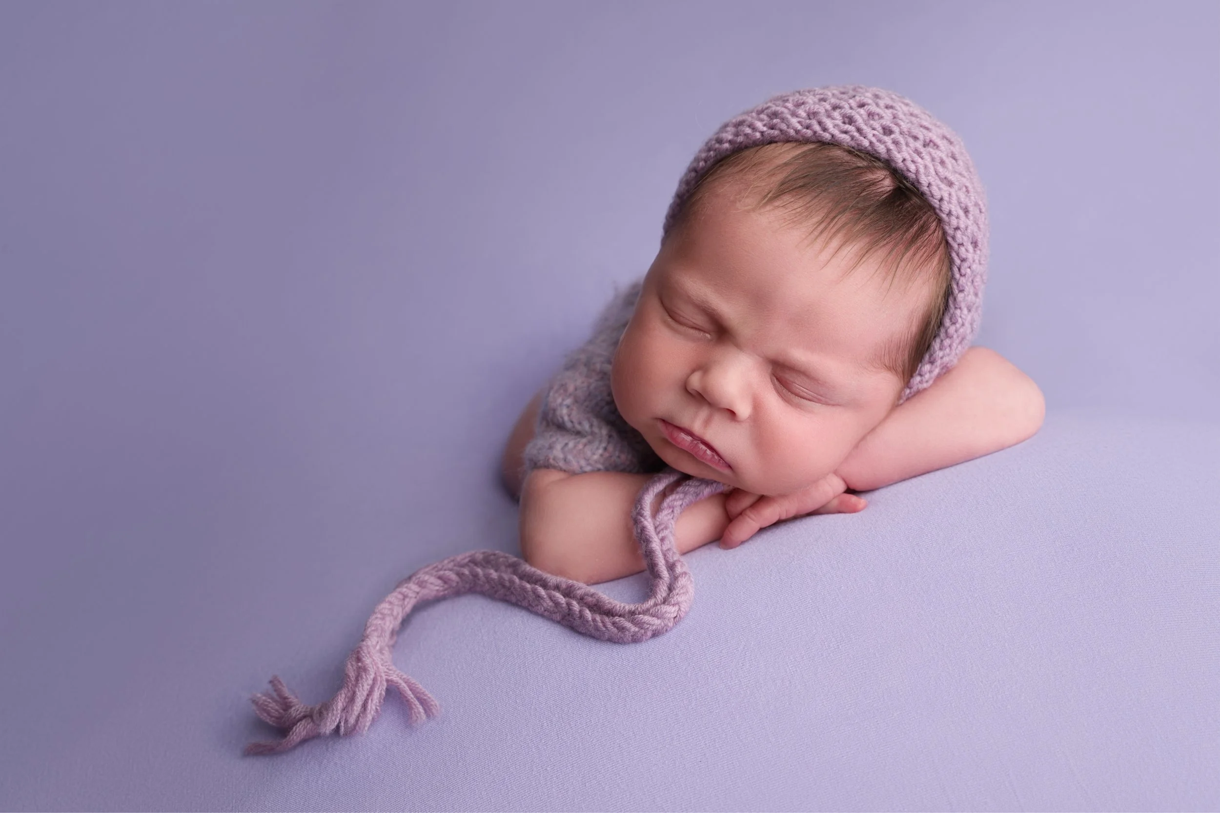 Baby girl on lilac with lilac hat