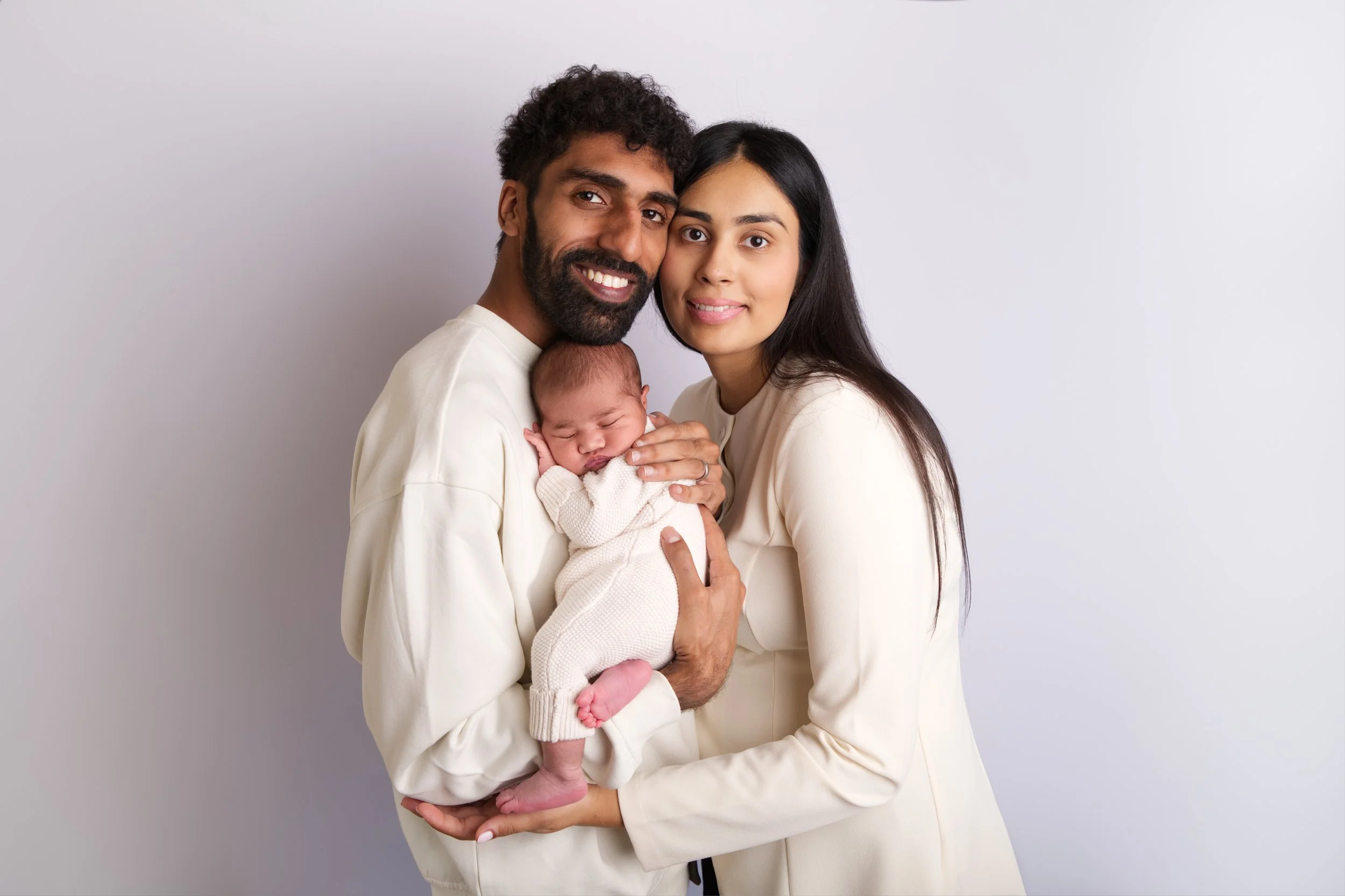 Parents and baby on white background