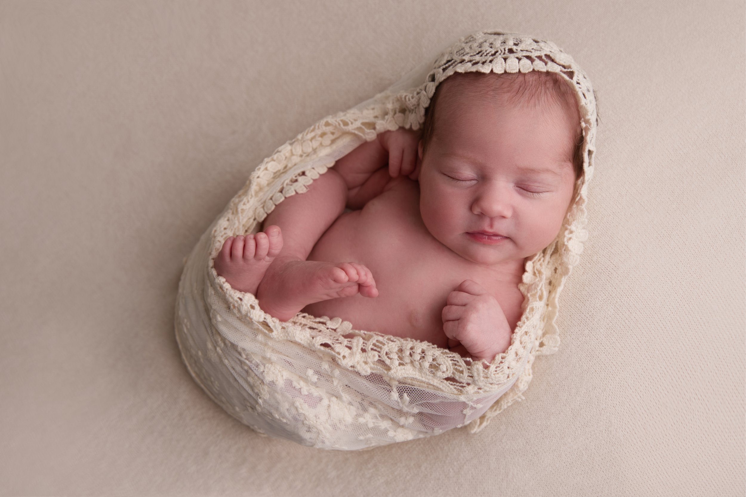 Baby girl wrapped in lace