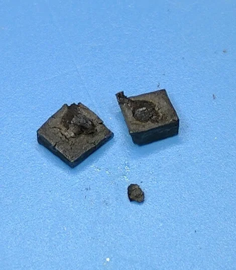 The piece on the right contains the die.