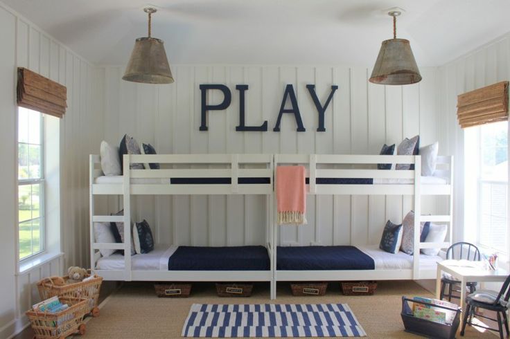 Two Ikea Bunkbeds have been placed end to end to create this great look and take up very little floor space while maximizing the space for sleeping four. 