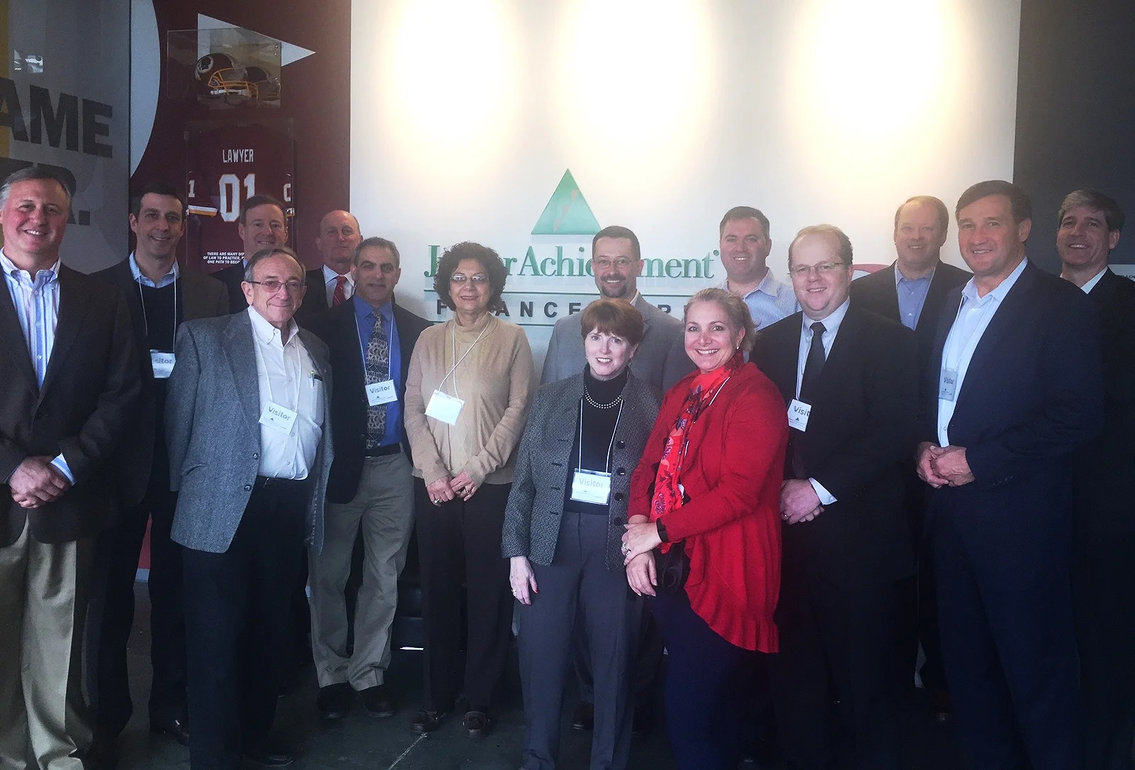 Members of the JA Finance Park® Montgomery County Advisory Council on a tour of the JA Finance Park® Prince George's County facility. Pictured (left to right) is Ed Grenier, Pete Briskman, David Samuels (back), Larry Shulman (front), Rich LaFleur (back), Steve Simon, Shahnaz Tabibi, Derek Whitwer (back), Ginanne Italiano (front), Susan Burkinshaw, Jake Ginsberg, Mark Ellenbogen, Jeff Hearle, Mike Micholas, and Will Schroeder. 