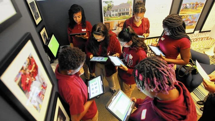 October 13, 2016: Dwight Eisenhower Middle School eighth grade students participated in an experimental learning program by working on tablet computers and learning about the importance of income; saving, investing and risk management; debit and credit; and budget. (Daniel Kucin Jr. / Baltimore Sun Media Group)