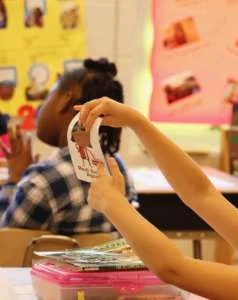 Second-graders got a lesson in economics at Woodlin Elementary School Friday. (WTOP/Kate Ryan)