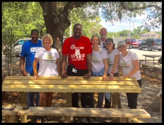 (L-R) Dr. Trevor Greene, Elizabeth Leib, Mr. Alege, Jennifer Webb, Alan Winton and Beth Bosserman Curts pose after INSTALLATION of the Greco OUTDoOR Classroom. TTF2S Coordinated efforts with the USF School of ARCHITECTURE and Commuity Design to build the outdoor classroom at Greco.