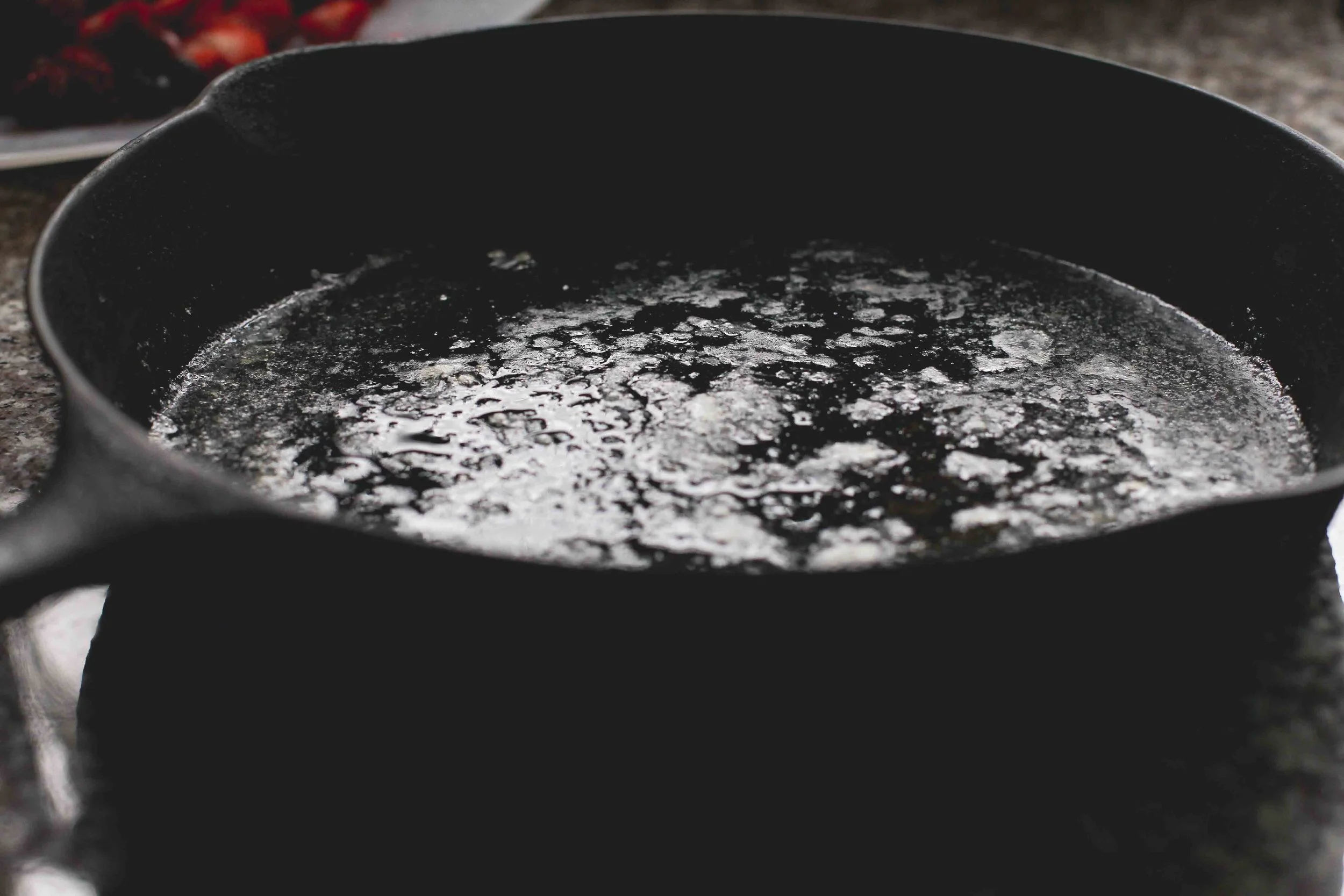 Remove melted butter from oven