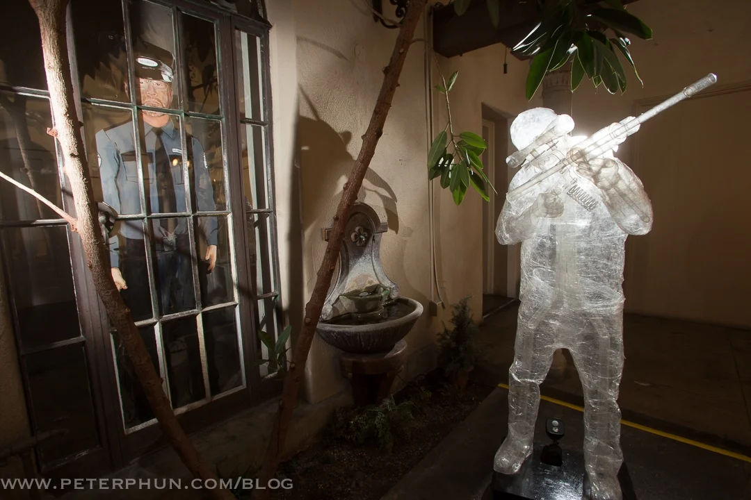 A security guard watches the shooter take aim.