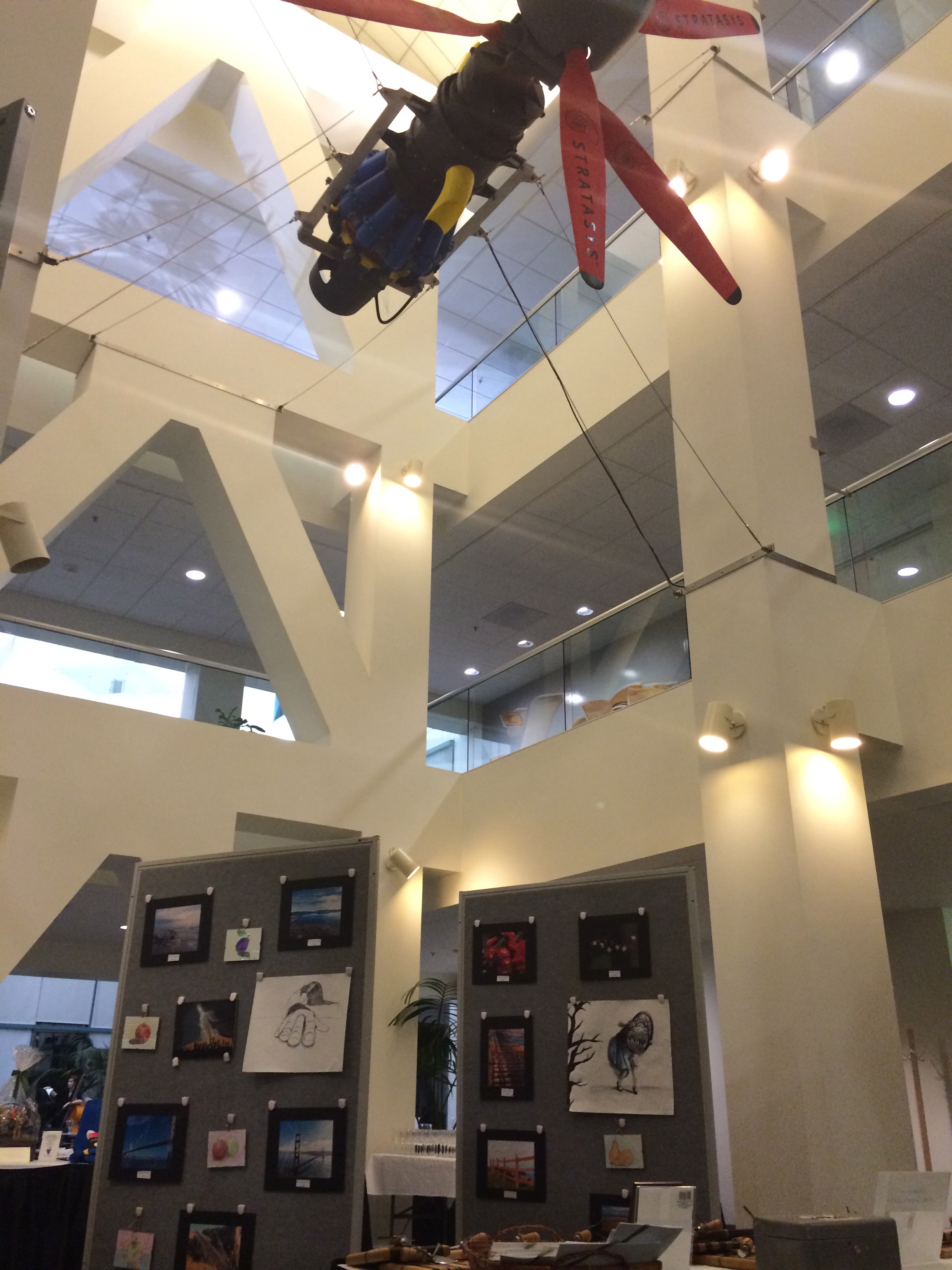 AE@TL Parent Volunteers installed student art in the Audodesk Atreium for the Wine & Cheese Reception benefiting the TL Scholarship Foundation 