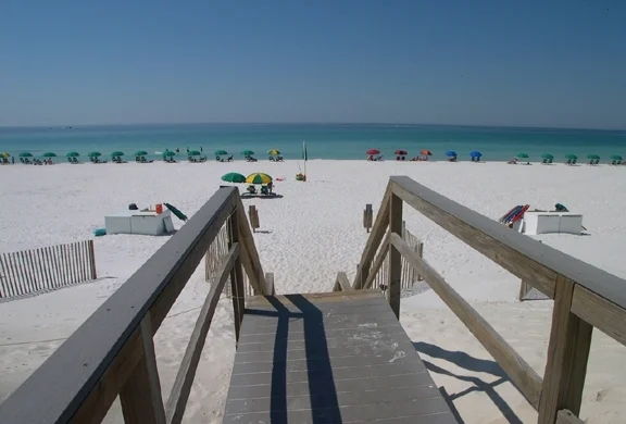 Walkway to the private sugar white beach