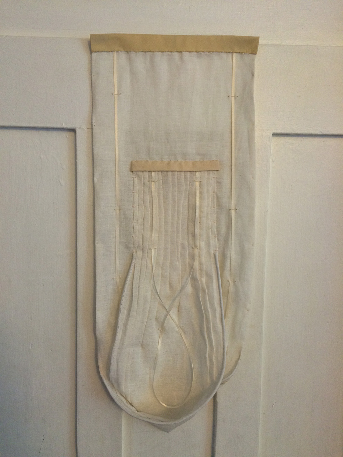 A three-dimensional white composition in pintucked linen. Going to The Frye Museum Store in Seattle, WA