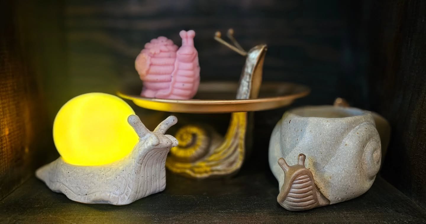 🌧️Feeling like a snail or slug with all this rain? Same. But hey, at least they are cute. 🐌

I've been trying to embrace my inner snail with the cutest collection of rainy day pick-me-ups:

☕ Reusable 🐌 coffee mug candles
✨ Gold snail platters
🌟 
