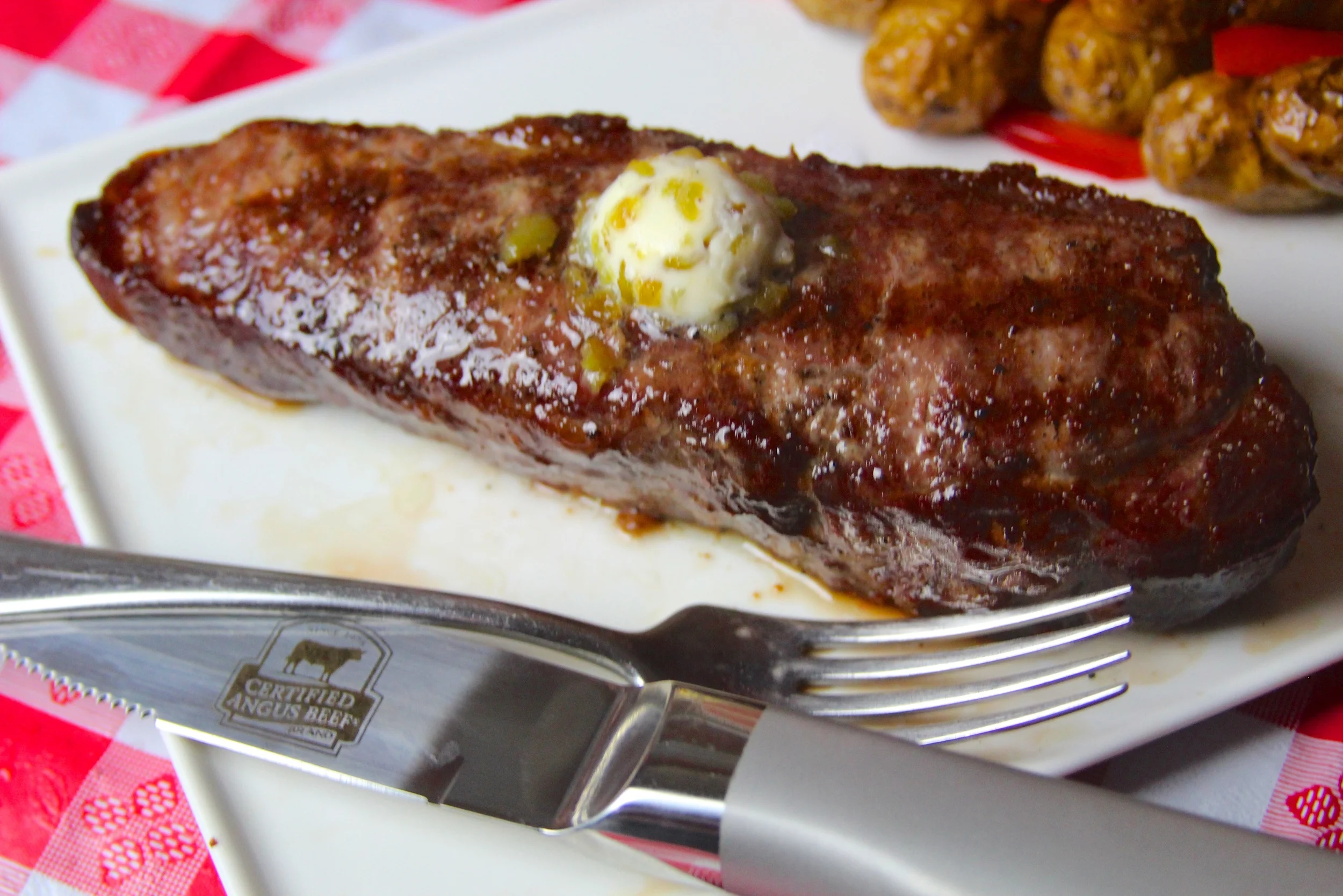 Grilled Sous Vide Strip Steak with Hatch Chile Butter — Grillocracy