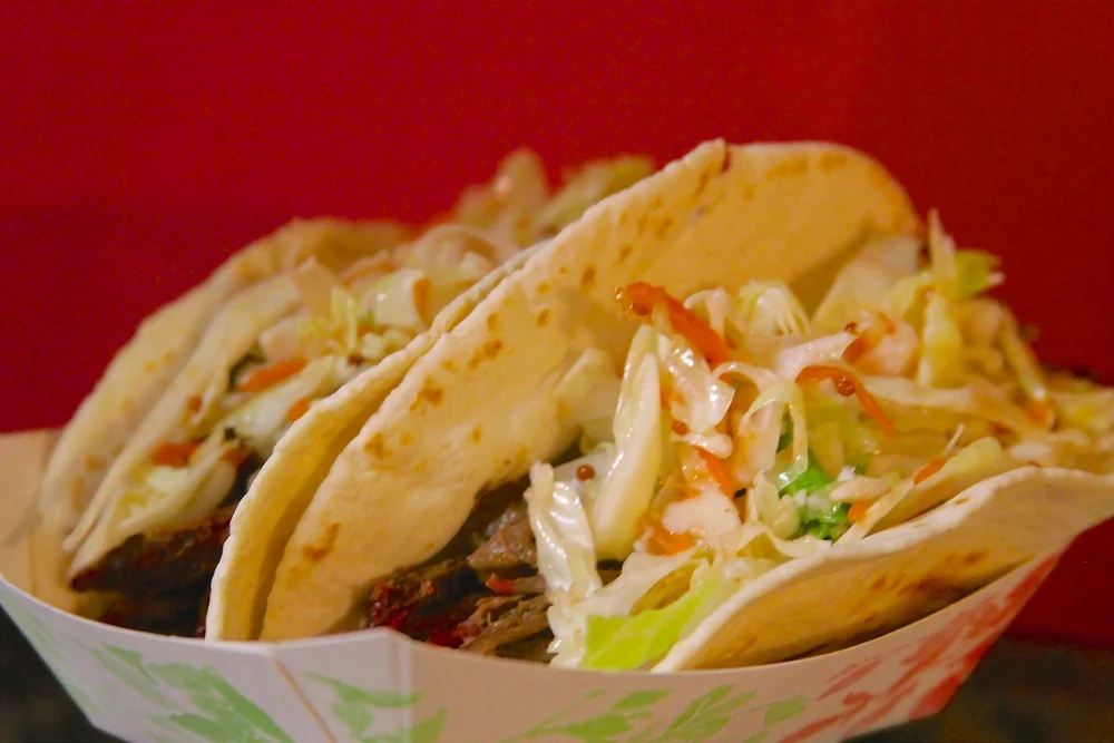 SMOKED PULLED BEEF TACOS WITH TANGY SLAW
