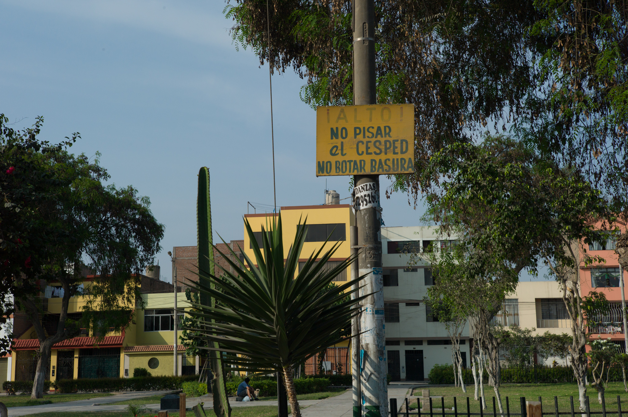  Another fenced park. The sign reads "stop! Do not step on grass, do not litter." 