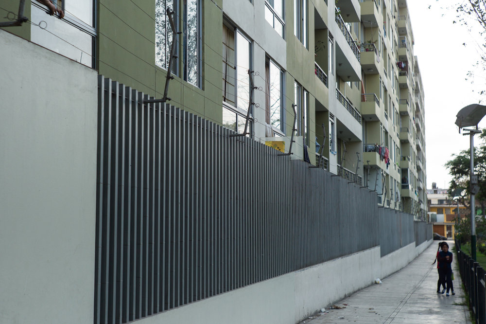  The perimeter of the building is heavily guarded by a tall wall, an electric wire, cameras and a private guard who walks the perimeter of the building occasionally. 