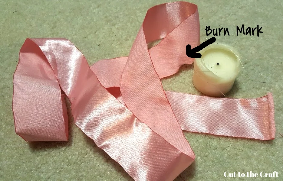 I more or less just worked through the little burns, because you can fold the fabric so that it doesn't really show. Anything that takes up more than half of the width of the ribbon, however, is much harder to work around.