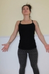 Moutain Pose with feet hip width apart.
