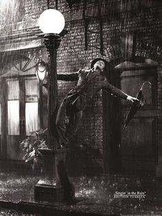 Gene Kelly living it up in the rain. 