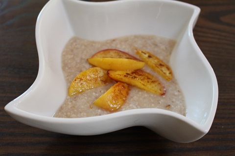 Barley, coconut milk, coconut sugar and peaches in coconut oil breakfast.