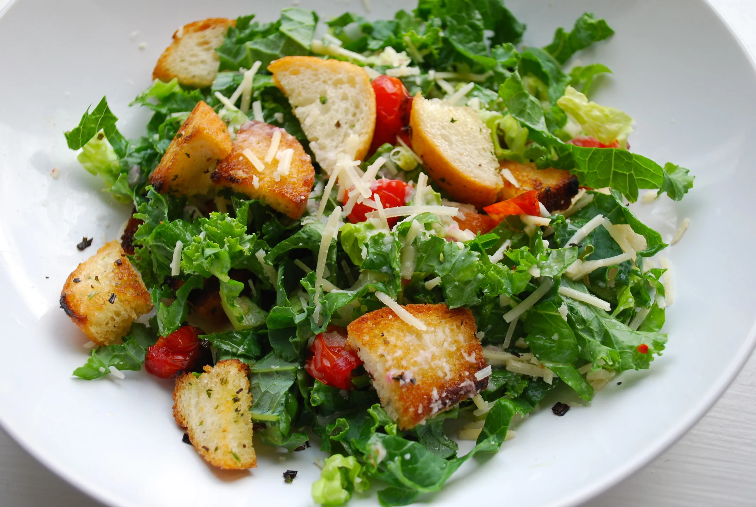   CRUNCY ROMAINE AND KALE SALAD      AUTHOR: DESIGN&amp;DIGEST  RECIPE TYPE: SIDE, SALAD  SERVES: 6     PREP TIME: 20 MINS  COOK TIME: 10 MINS  TOTAL TIME: 30 MINS     INGREDIENTS:  - 1/2 BUNCH KALE, FINELY CHOPPED  - 2 HEAD ROMAINE LETTUCE, FINELY C