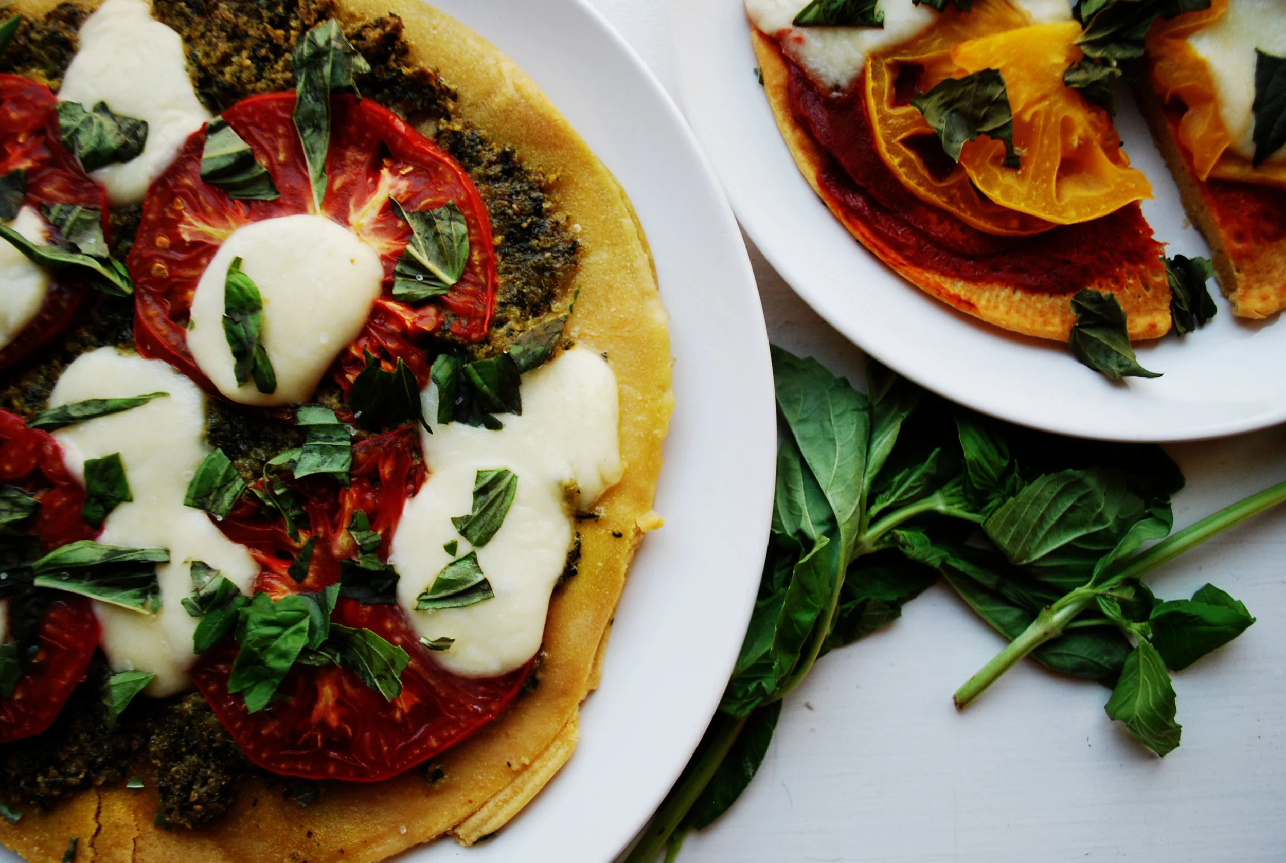   HEIRLOOM TOMATO AND PESTO PIZZA      AUTHOR: DESIGN&amp;DIGEST  RECIPE TYPE: ENTREE  SERVES: 4     PREP TIME: 20 MINS  COOK TIME: 30-40 MINS  TOTAL TIME: 50-60 MINS     INGREDIENTS:  FOR THE CRUST:  - 1 1/2 CUPS GARBANZO BEAN FLOUR (CHICKPEA FLOUR)