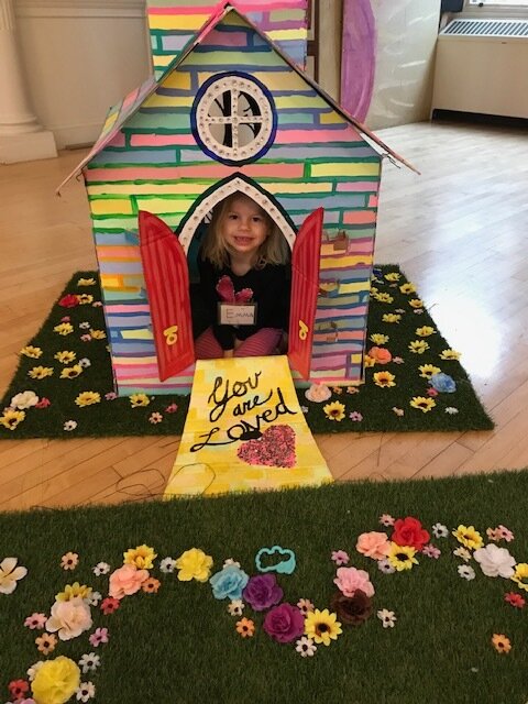 Ella hanging out in our 2019 Pride Decorations.