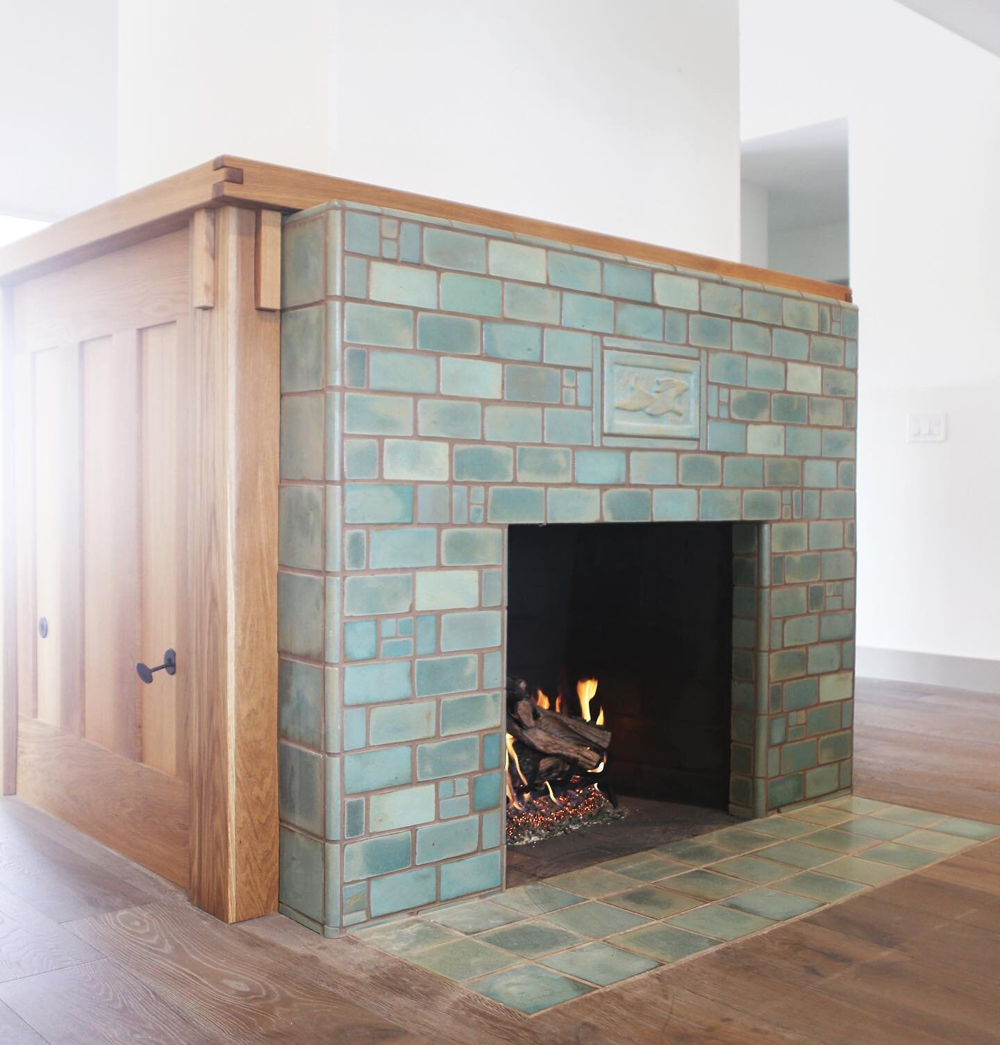 Simple doesn&rsquo;t have to be boring! 
Celadon, Verdigris, and Lichen glazes in this freestanding fireplace 
#bluetiles #greentiles #fireplacedesign #fireplacemakeover  #customfireplace #hygge #craftsmantile #traditionalinteriors