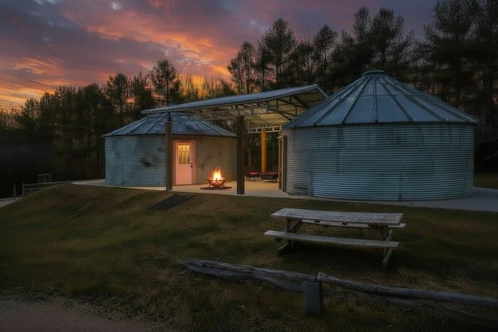 two silo cabins at night