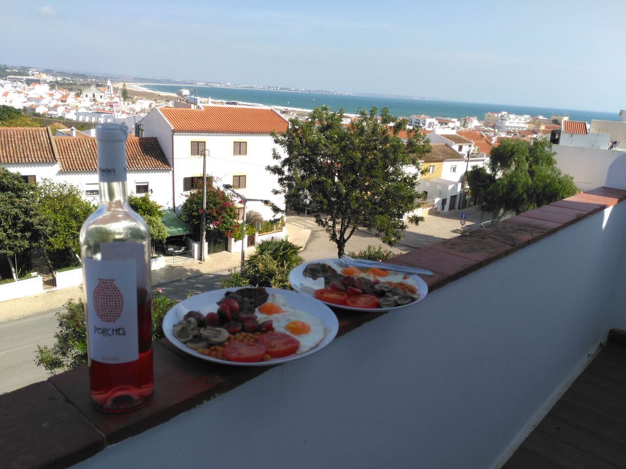 Breakfast and rosé on the balcony.