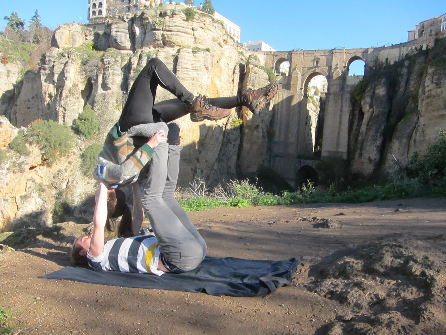 We got to test out the acroyoga we've been practicing in front of the Ronda bridge!