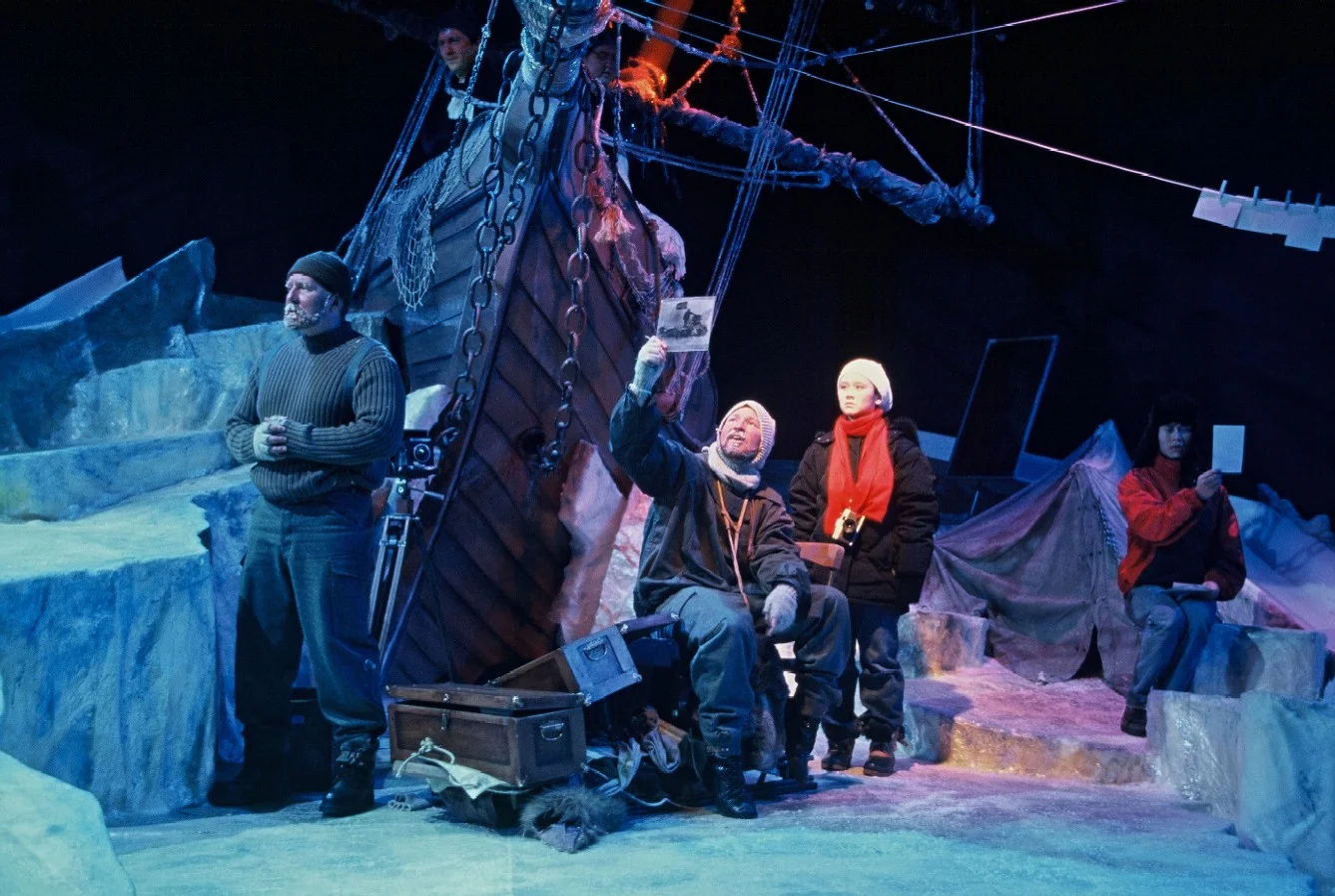 FROZEN Earnest Shackleton, expedition photographer Frank Hurley and Leigh examine plate glass negatives beside the doomed ship Endurance, swallowed by Antarctic ice. 