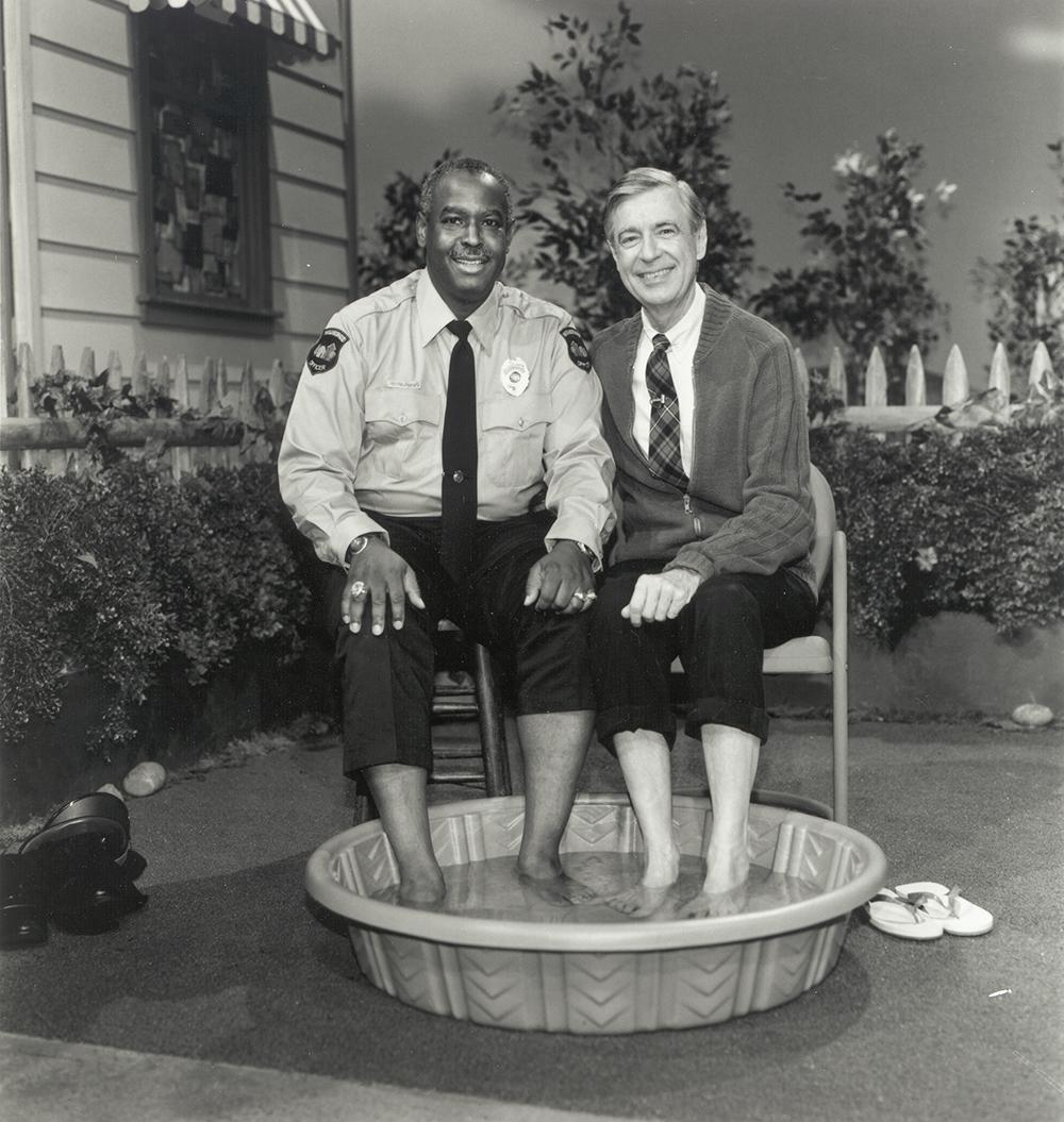 (Officer Clemmons and Mister Rogers, reprising their 1969 foot bath, during their final scene together in 1993 | The Fred Rogers Company)