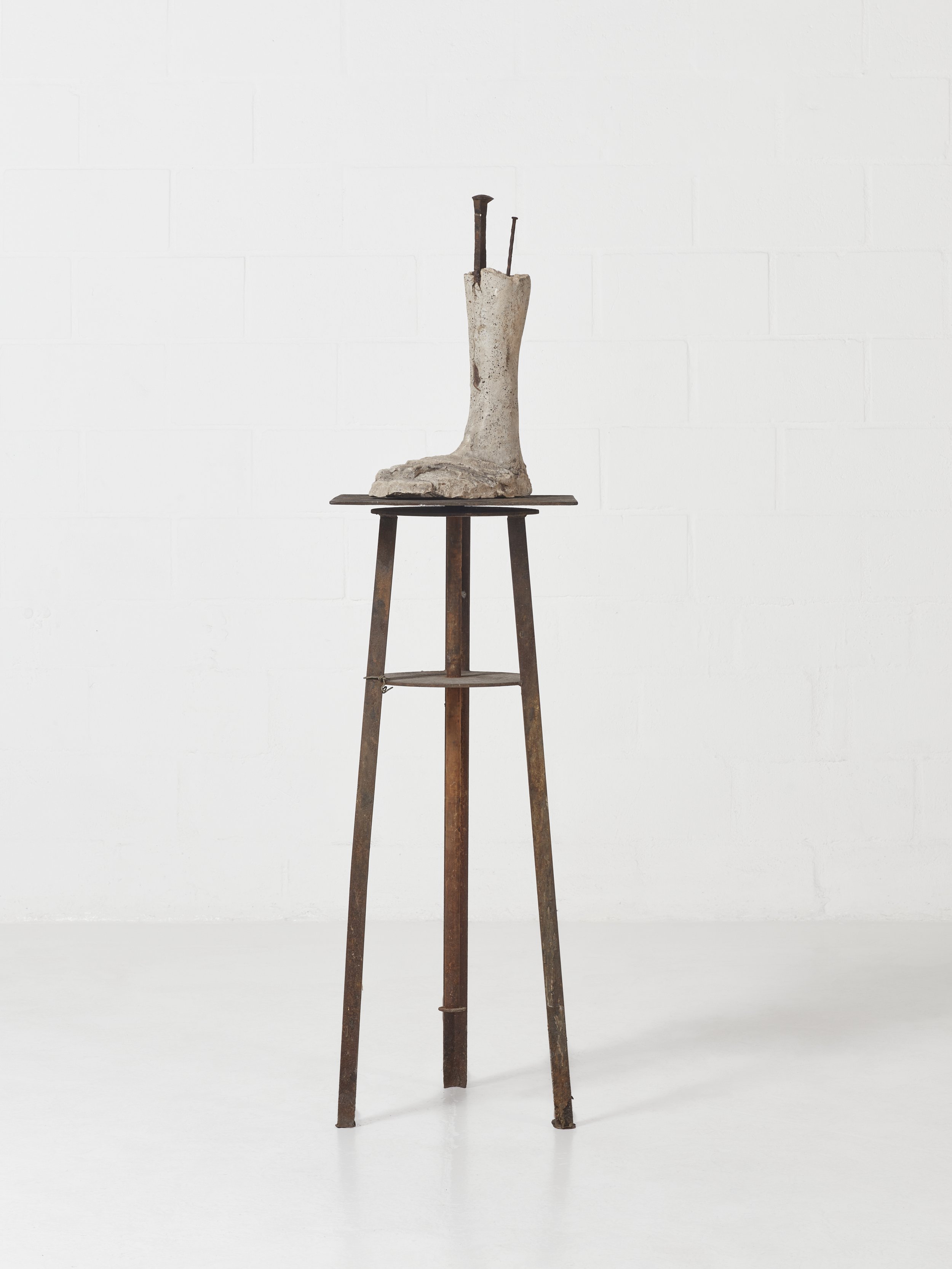 Ogun's foot (Osin Imole), 2023 Found objects, nails, railway spike, cowrie shells 63.4 × 16.5 × 16.5 inches